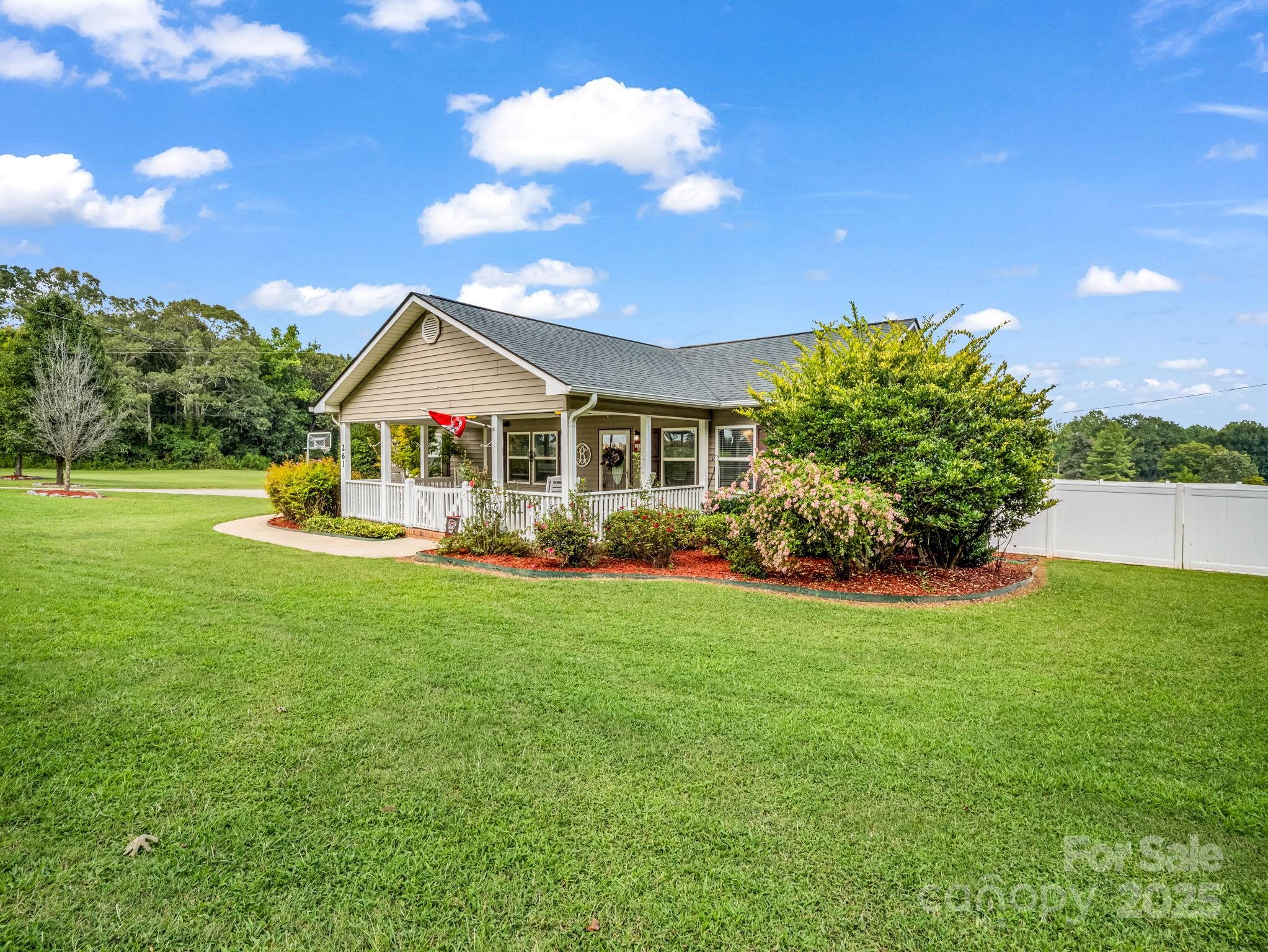 261 Faye Toney Road Mooresboro, NC 28114 - Photo 3 of 48 a front view of a house with garden