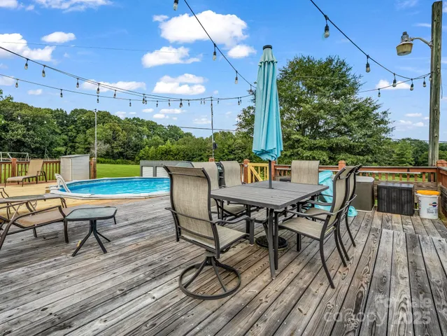 a view of a swimming pool with a patio