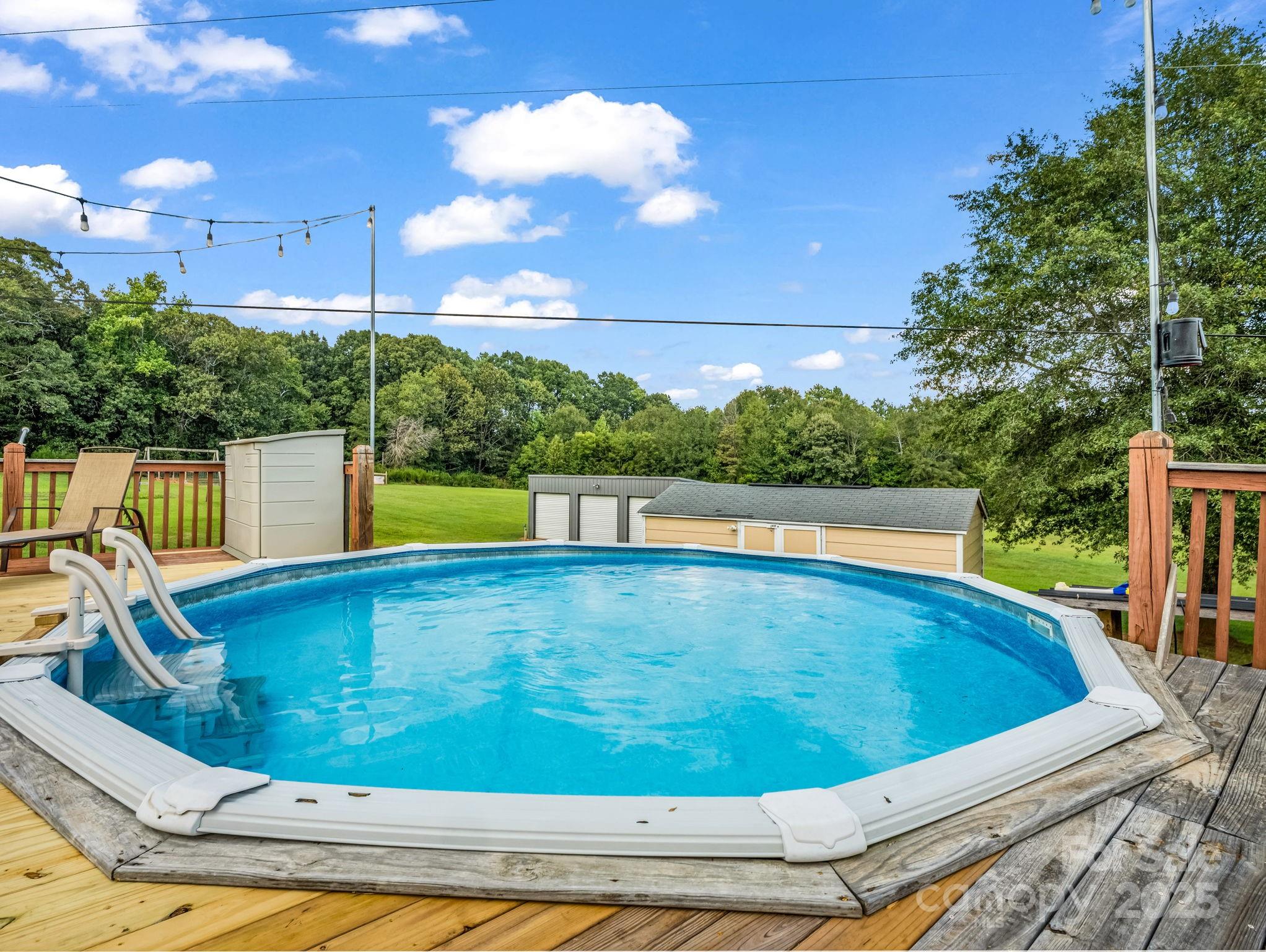 261 Faye Toney Road Mooresboro, NC 28114 - Photo 33 of 48 a view of a swimming pool with a patio