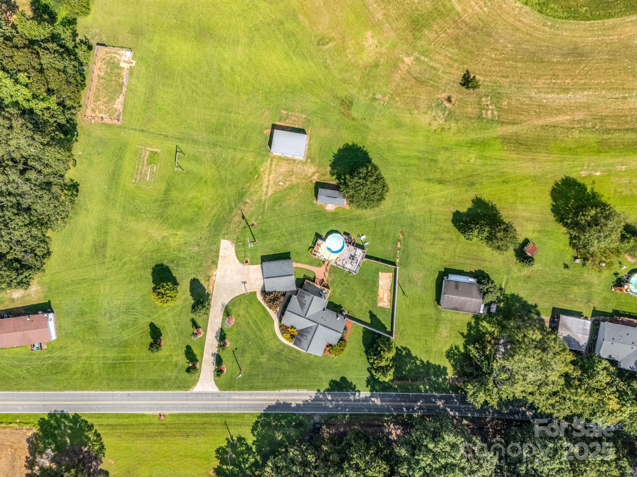 261 Faye Toney Road Mooresboro, NC 28114 - Photo 34 of 48 an aerial view of a residential houses with swimming pool