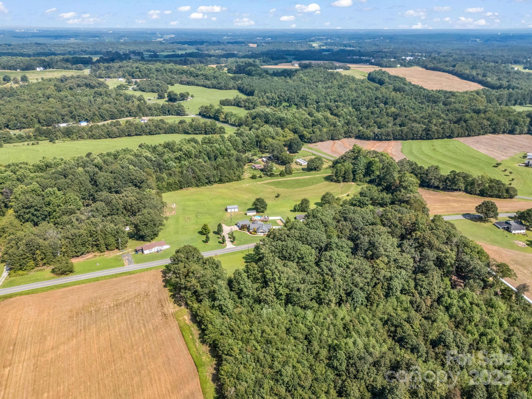 261 Faye Toney Road Mooresboro, NC 28114 - Photo 37 of 48 a view of a city with lush green forest