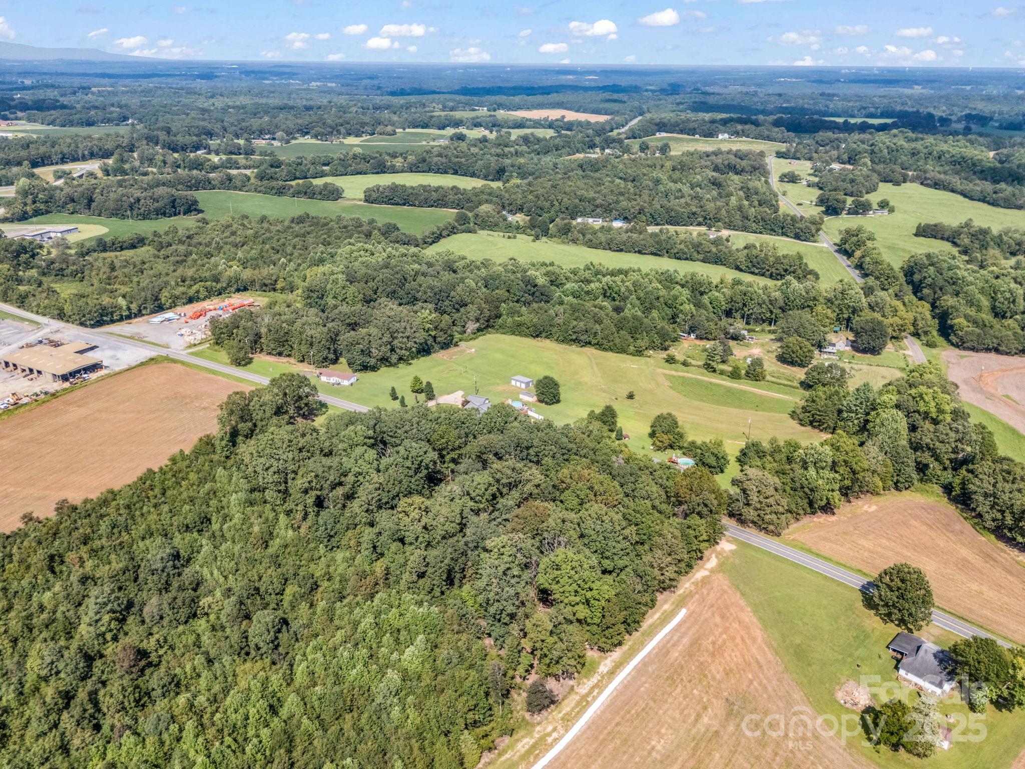 261 Faye Toney Road Mooresboro, NC 28114 - Photo 38 of 48 a view of a city with lush green forest