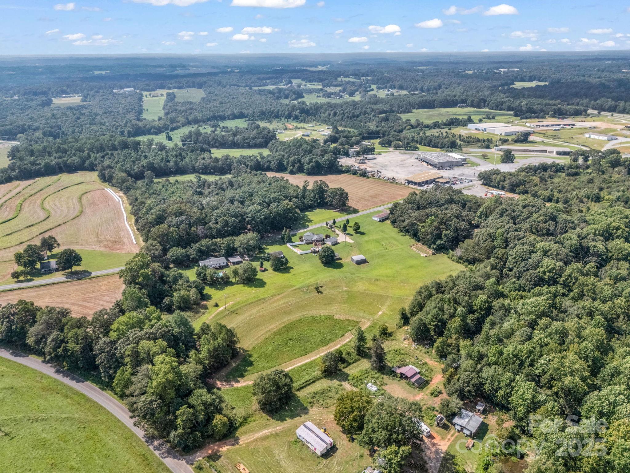 261 Faye Toney Road Mooresboro, NC 28114 - Photo 40 of 48 a view of a lake with a yard