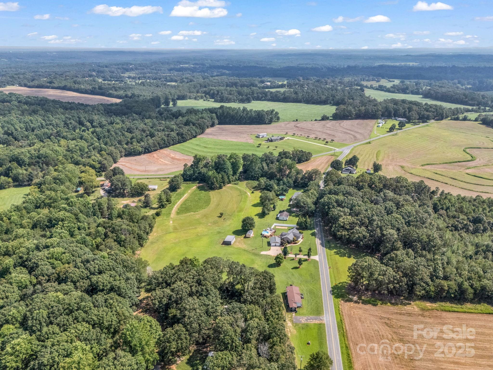 261 Faye Toney Road Mooresboro, NC 28114 - Photo 44 of 48 an aerial view of residential houses with outdoor space
