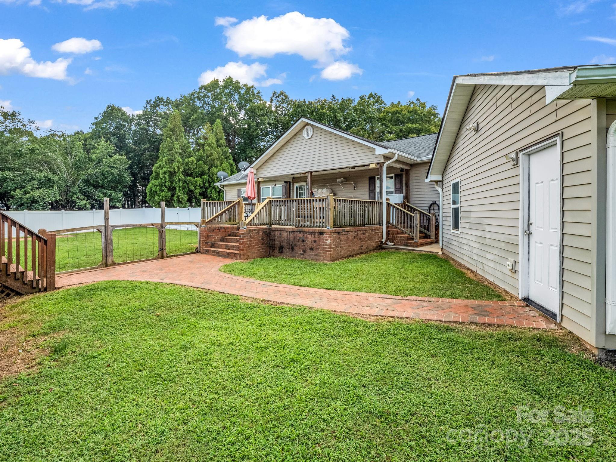 261 Faye Toney Road Mooresboro, NC 28114 - Photo 5 of 48 a view of a house with a yard and sitting area