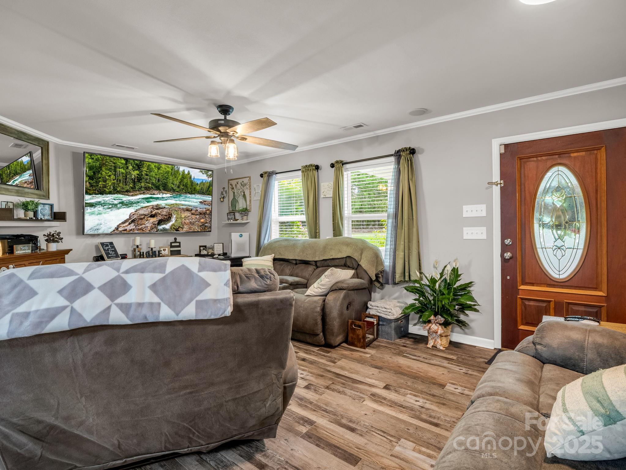 261 Faye Toney Road Mooresboro, NC 28114 - Photo 8 of 48 a living room with furniture chandelier and a large window