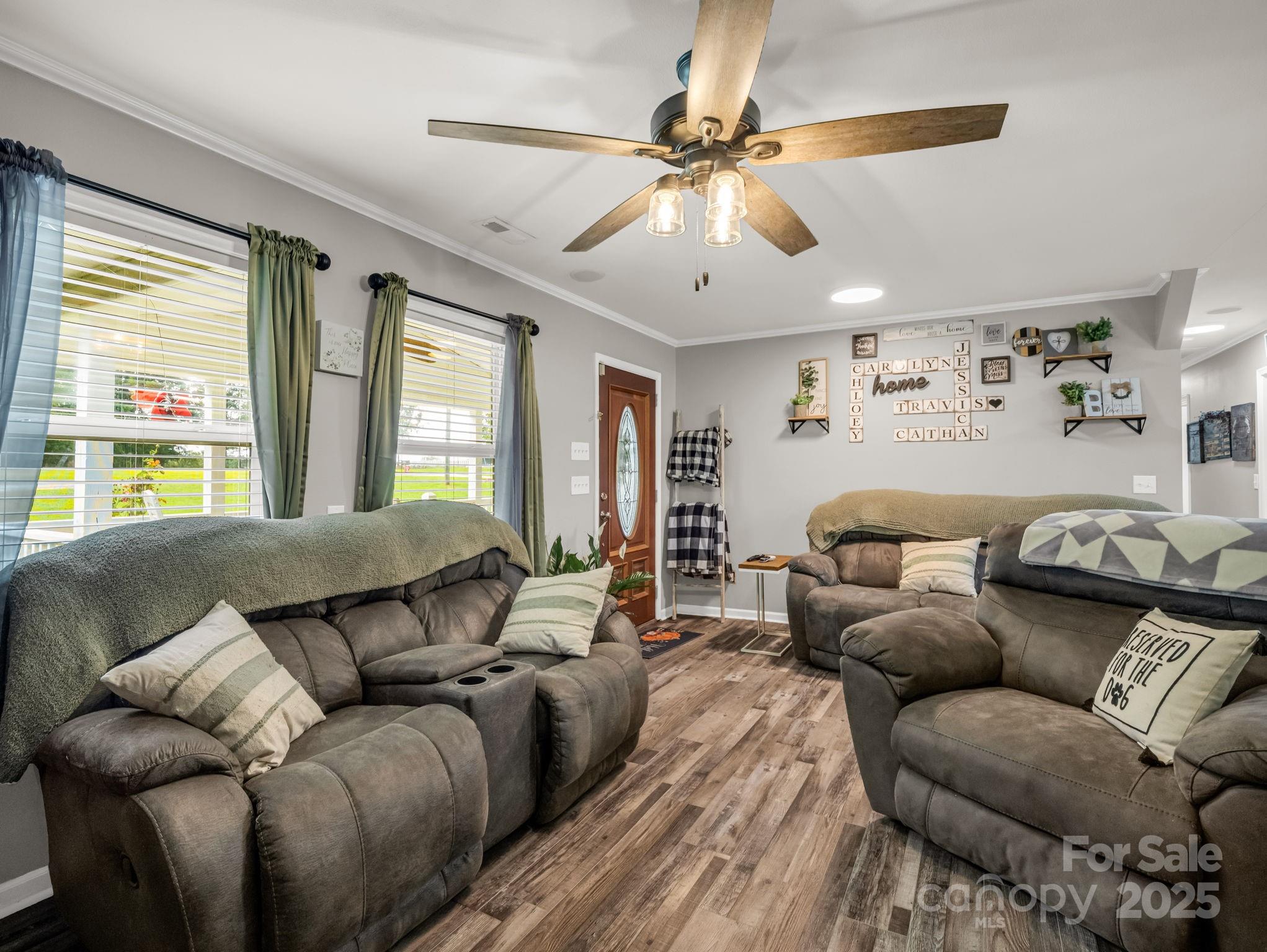 261 Faye Toney Road Mooresboro, NC 28114 - Photo 9 of 48 a living room with furniture and a large window