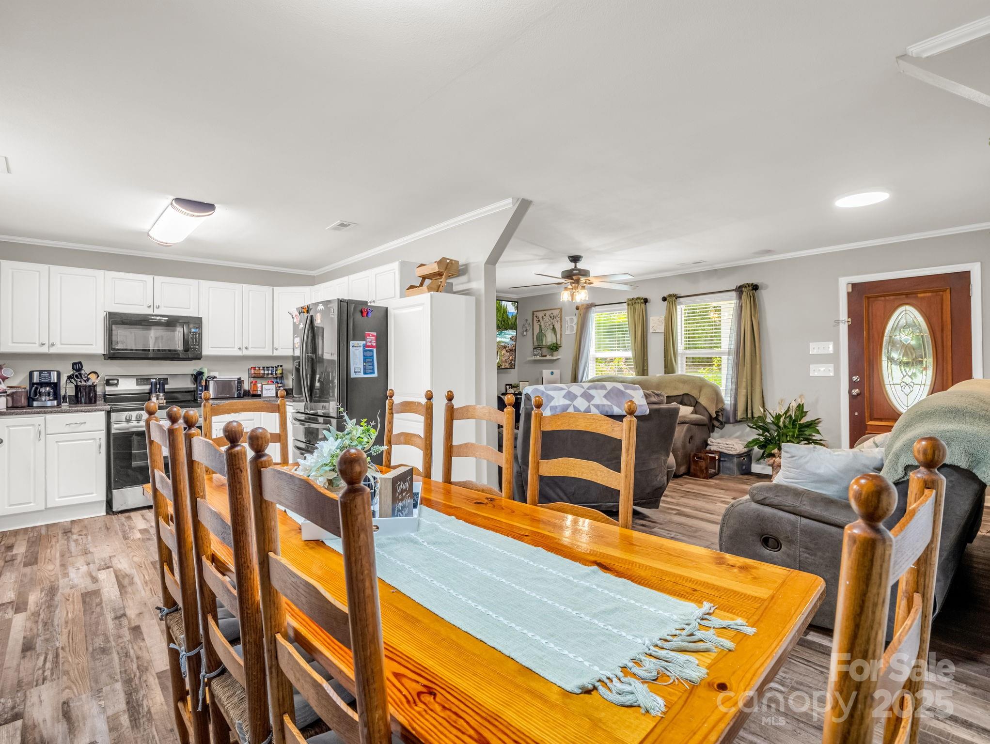 261 Faye Toney Road Mooresboro, NC 28114 - Photo 10 of 48 a living room with lots of furniture and kitchen view
