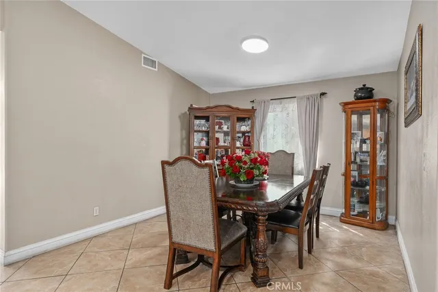 a dining room with furniture and window