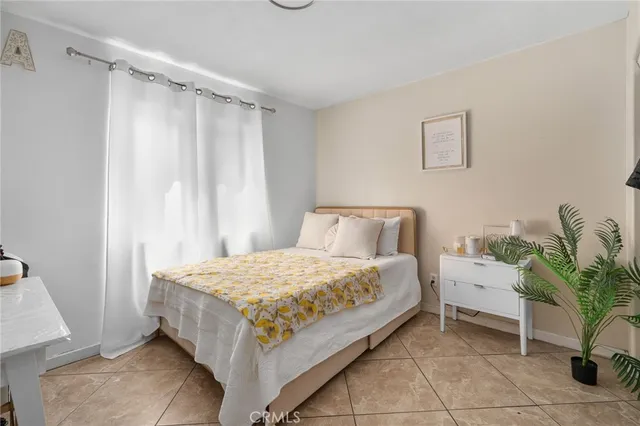 a bedroom with a bed and a table