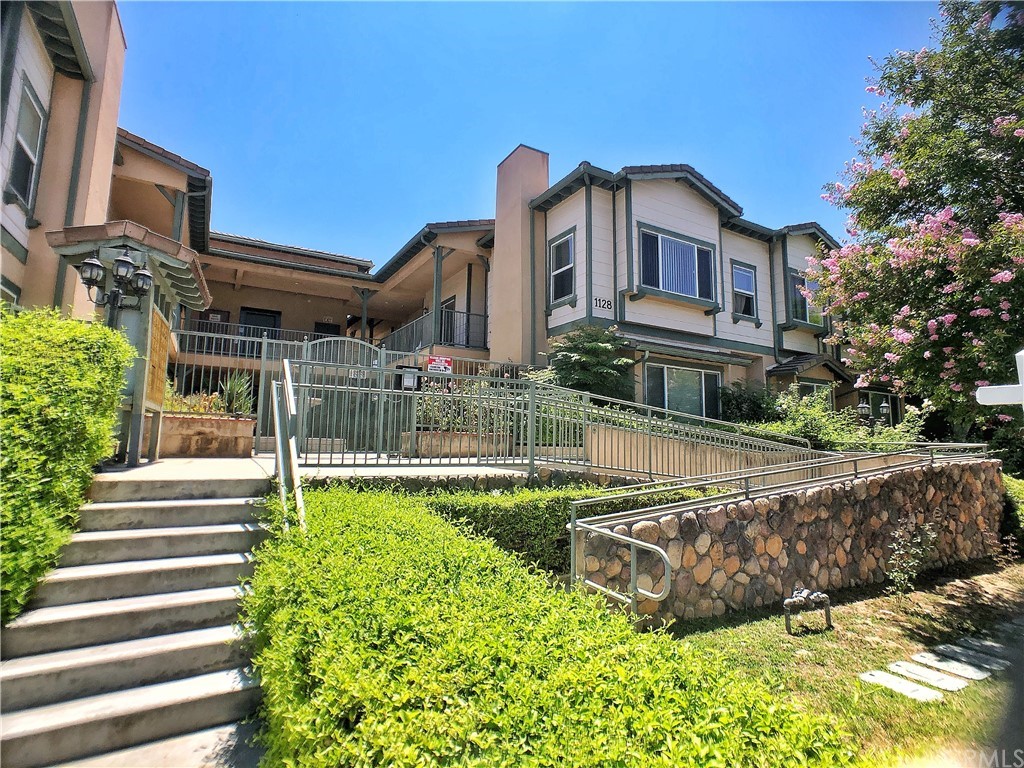1128 West Duarte Road, Unit J Arcadia, CA 91007 - Photo 1 of 1 a front view of a house with a yard