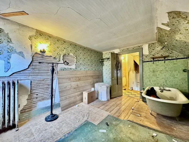 a spacious bathroom with a bathtub and shower