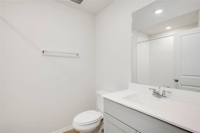a view of a kitchen with a refrigerator and a sink