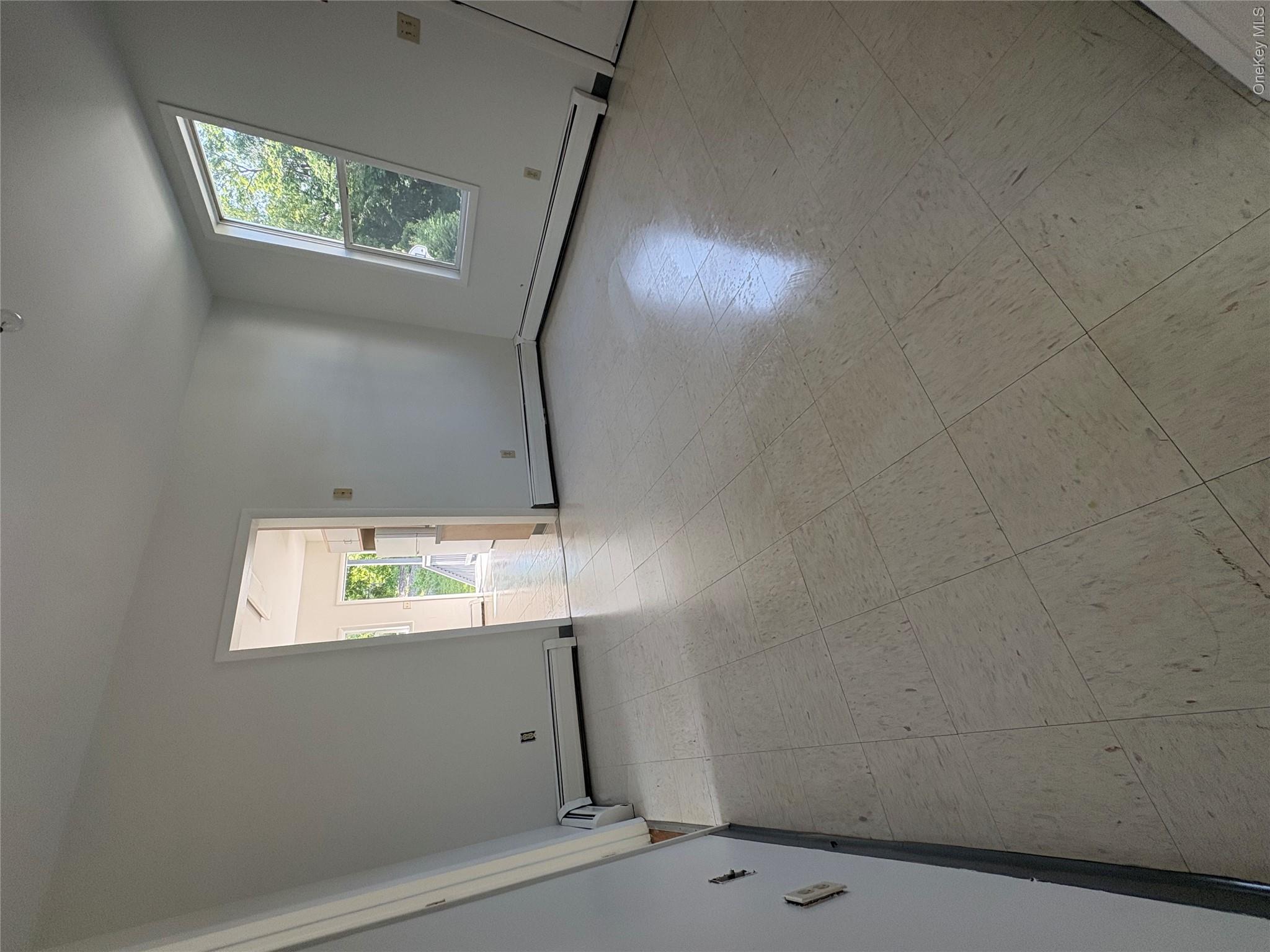 11 Fallkill Avenue Poughkeepsie, NY 12601 - Photo 4 of 9 an empty room with windows