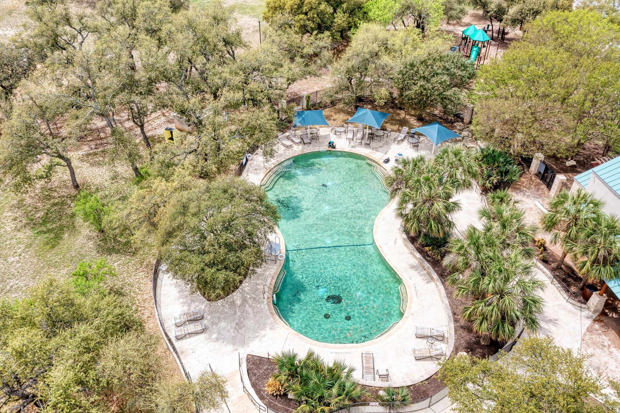 2601 North Quinlan Park Road, Unit 506 Austin, TX 78732 - Photo 35 of 39 Steiner Ranch pool and community center