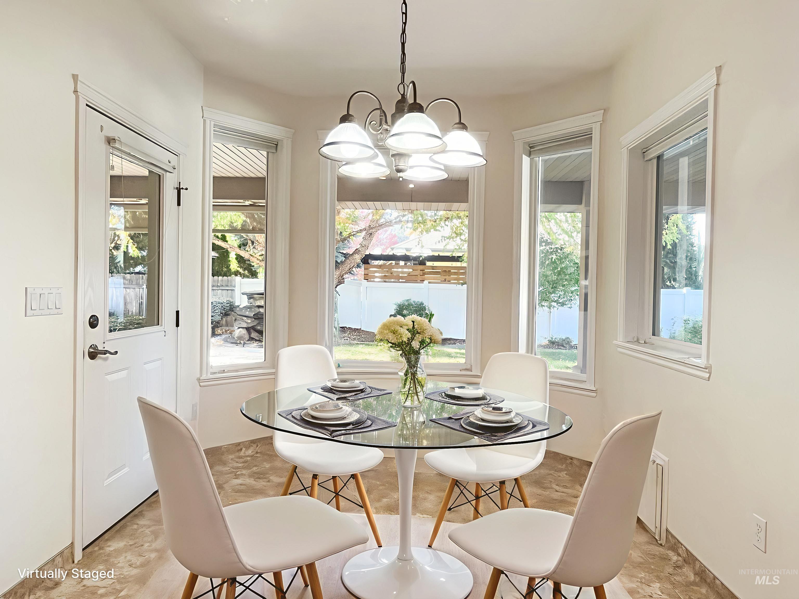 5231 North Morninggale Way Boise, ID 83713 - Photo 25 of 44 Dining room with a chandelier and healthy amount of natural light