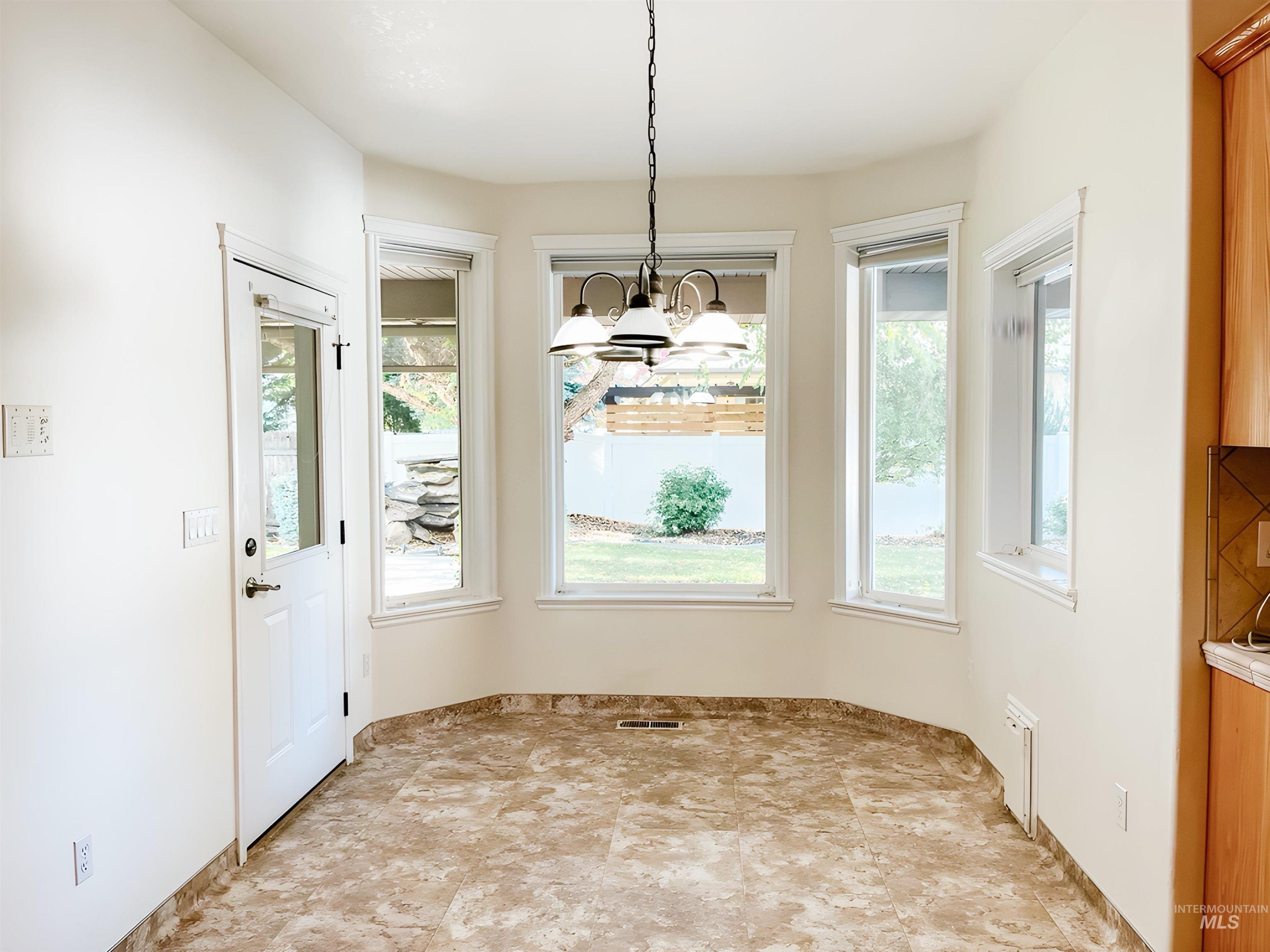 5231 North Morninggale Way Boise, ID 83713 - Photo 26 of 44 Unfurnished dining area with hanging lights