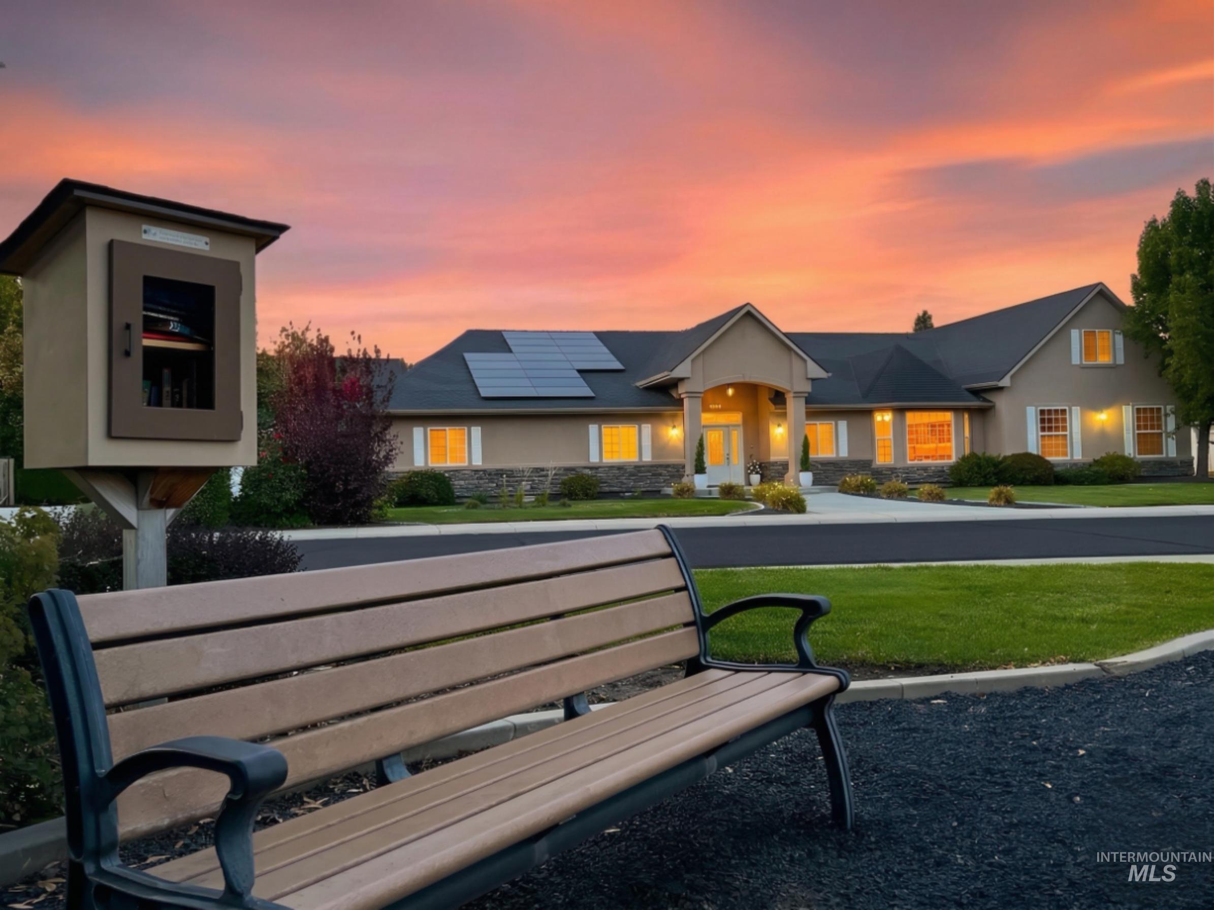 5231 North Morninggale Way Boise, ID 83713 - Photo 39 of 44 View of front of property with solar panels, a front yard, and stucco siding