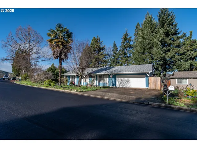 a view of a street with a building in the background