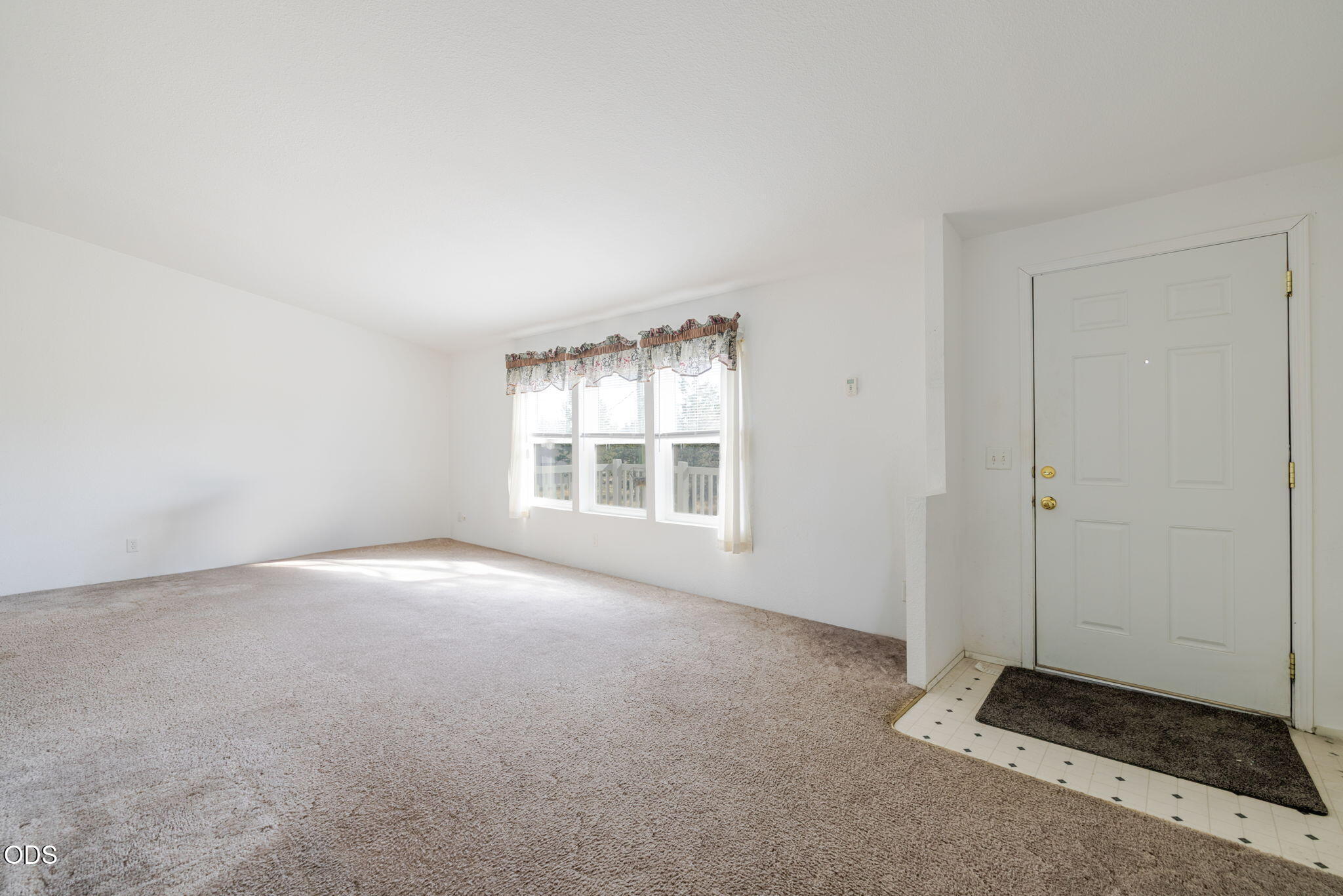8628 Southwest Crater Loop Road Terrebonne, OR 97760 - Photo 6 of 36 an empty room with windows
