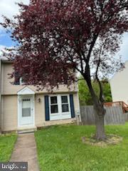 22 Morning Court Rosedale, MD 21237 - Photo 2 of 42 a front view of a house with a garden
