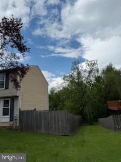 22 Morning Court Rosedale, MD 21237 - Photo 21 of 42 a view of a backyard with potted plants and wooden fence
