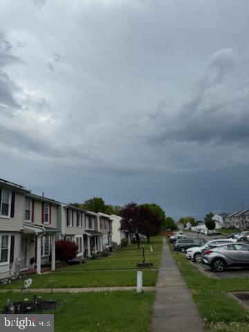 22 Morning Court Rosedale, MD 21237 - Photo 23 of 42 a view of houses with yard and car parked