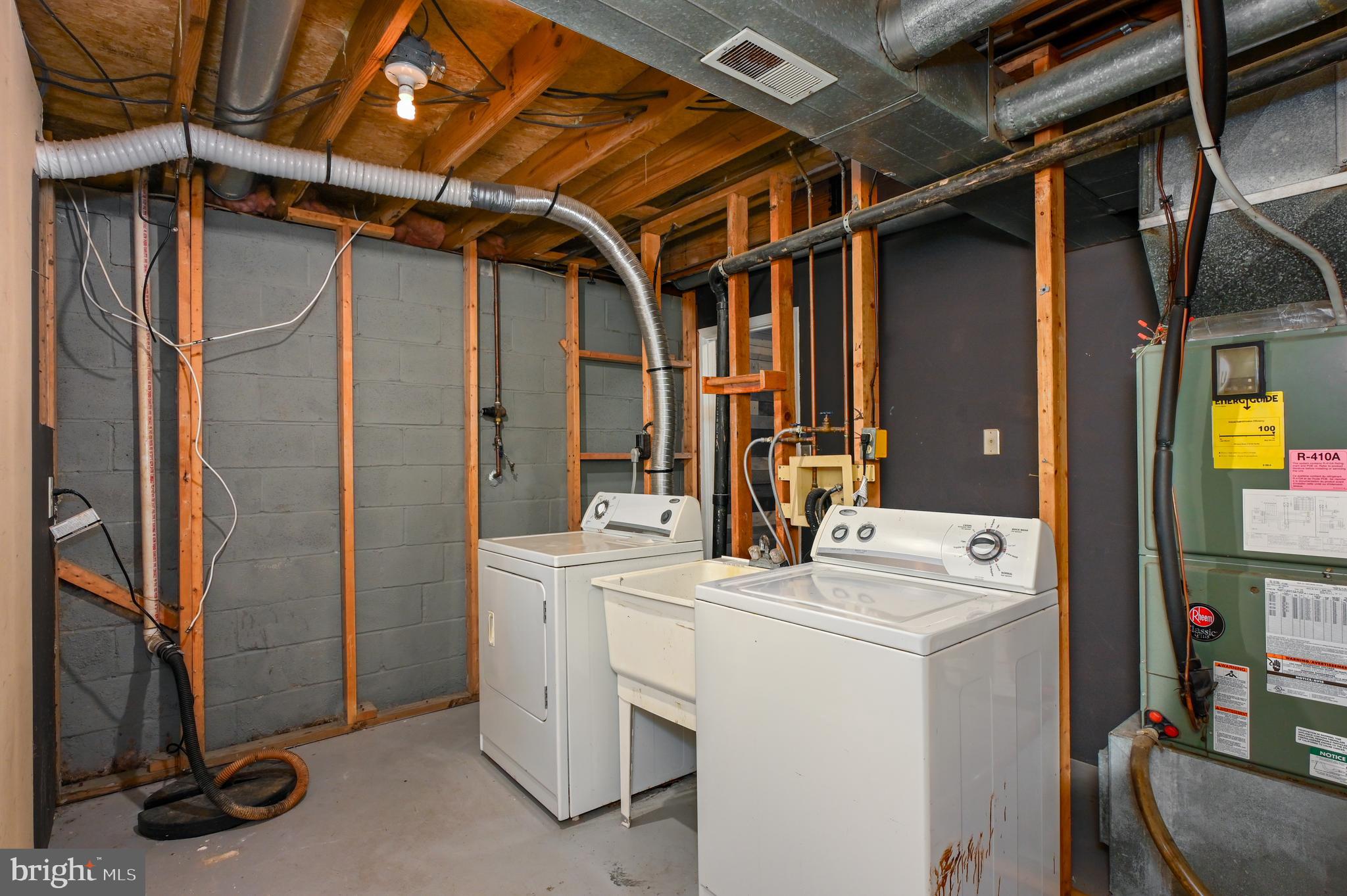 22 Morning Court Rosedale, MD 21237 - Photo 28 of 42 a utility room with dryer and washer