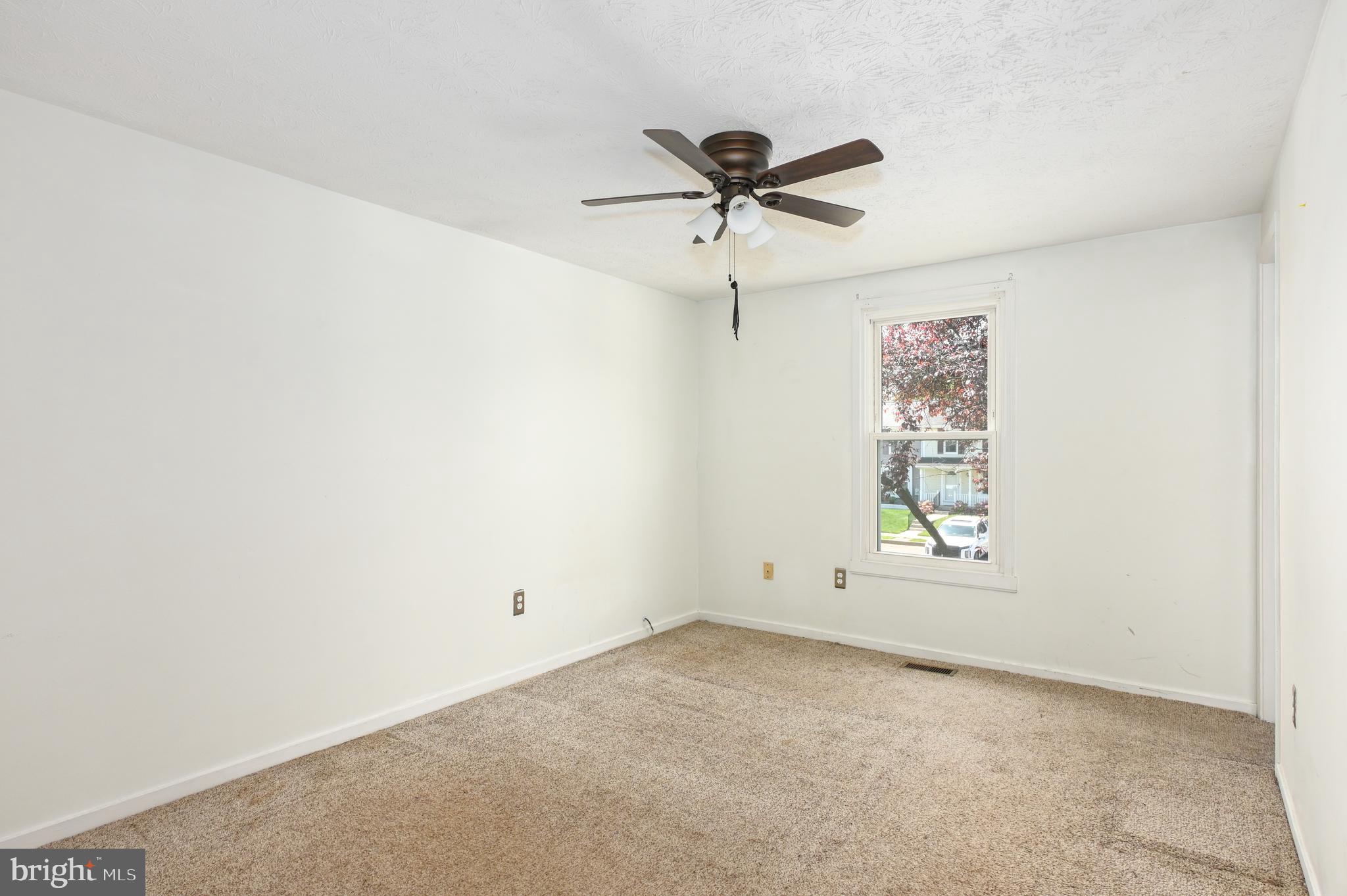 22 Morning Court Rosedale, MD 21237 - Photo 38 of 42 an empty room with a window and ceiling fan