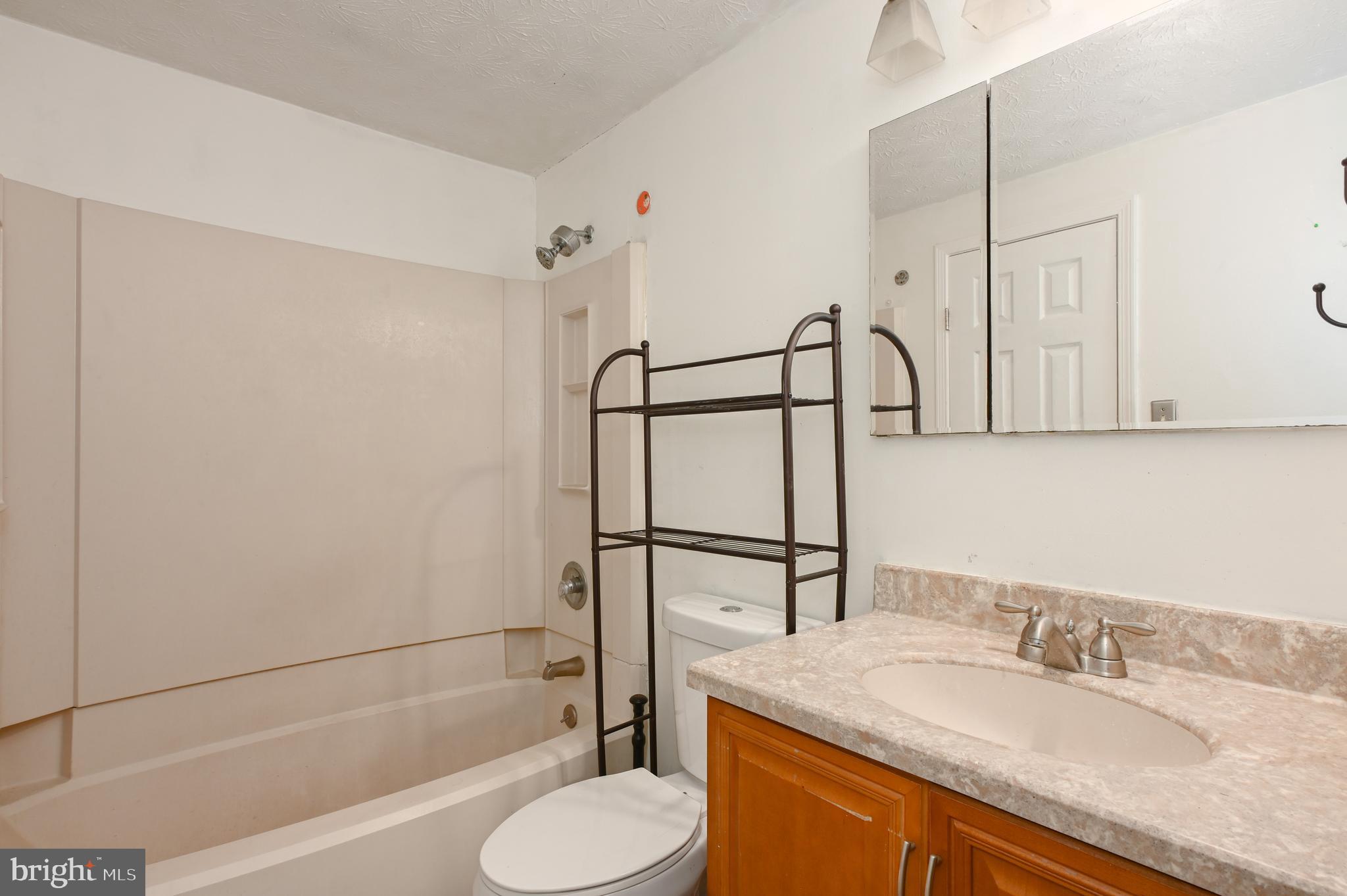 22 Morning Court Rosedale, MD 21237 - Photo 39 of 42 a bathroom with a granite countertop sink toilet and shower