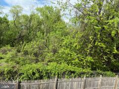22 Morning Court Rosedale, MD 21237 - Photo 40 of 42 a view of a yard with plants and wooden fence