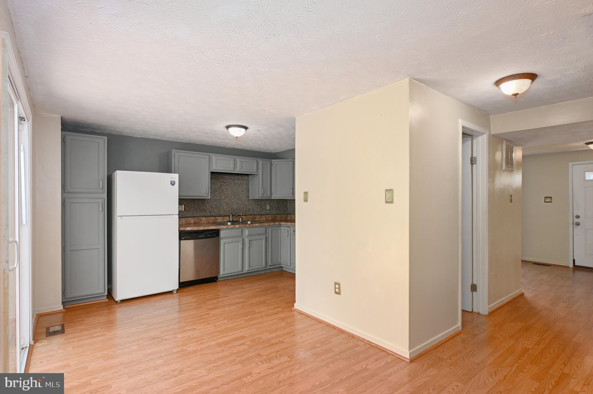 22 Morning Court Rosedale, MD 21237 - Photo 9 of 42 a kitchen with a refrigerator and a stove top oven