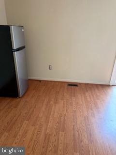 22 Morning Court Rosedale, MD 21237 - Photo 10 of 42 a view of an empty room and wooden floor