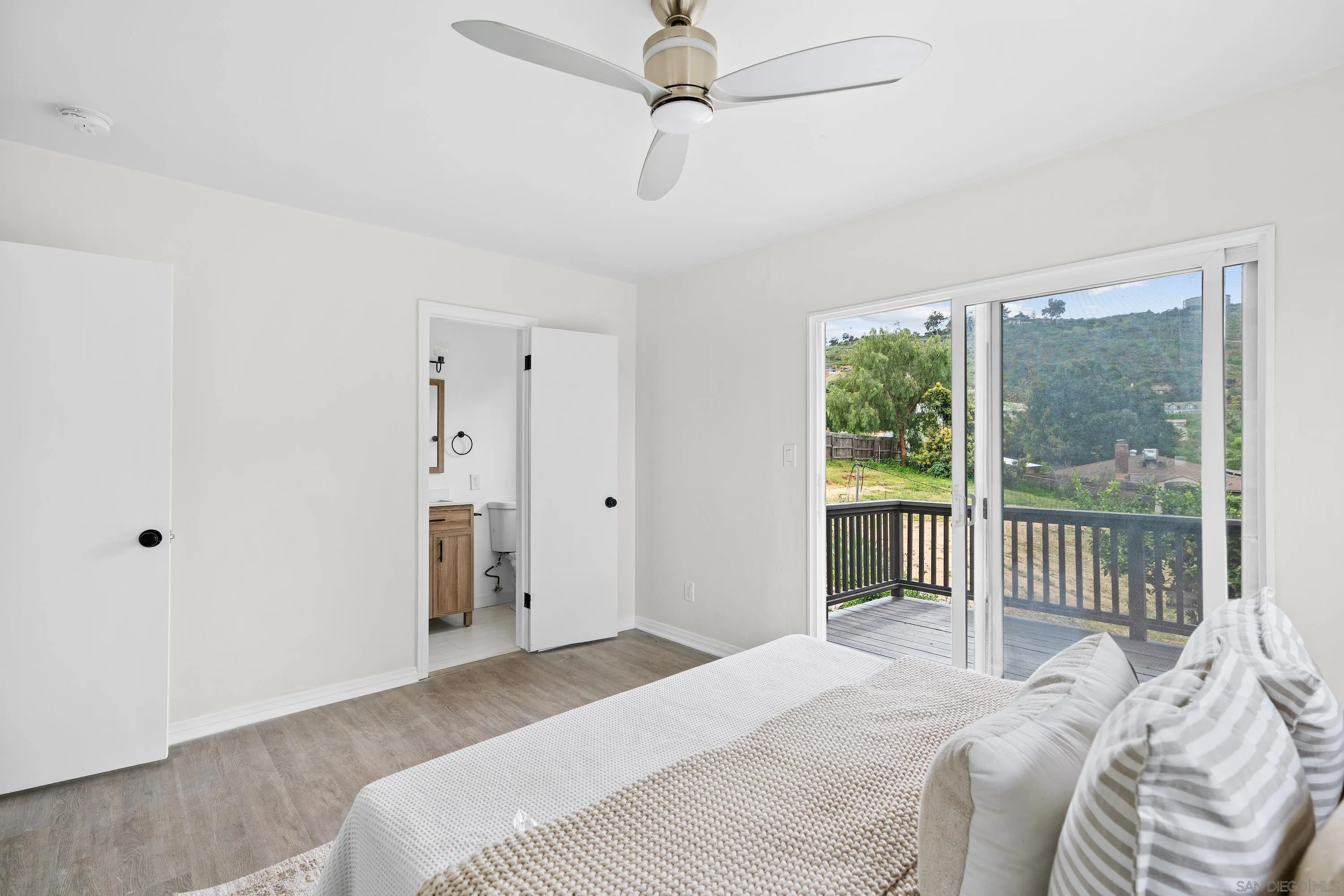 8612 Almond Road Lakeside, CA 92040 - Photo 17 of 30 a bedroom with a bed and a window