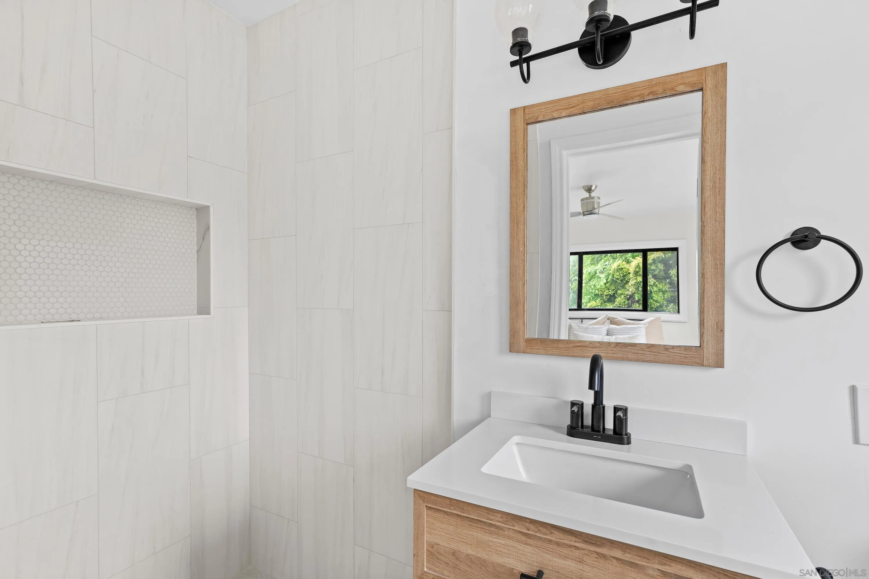 8612 Almond Road Lakeside, CA 92040 - Photo 18 of 30 a bathroom with a sink and a mirror