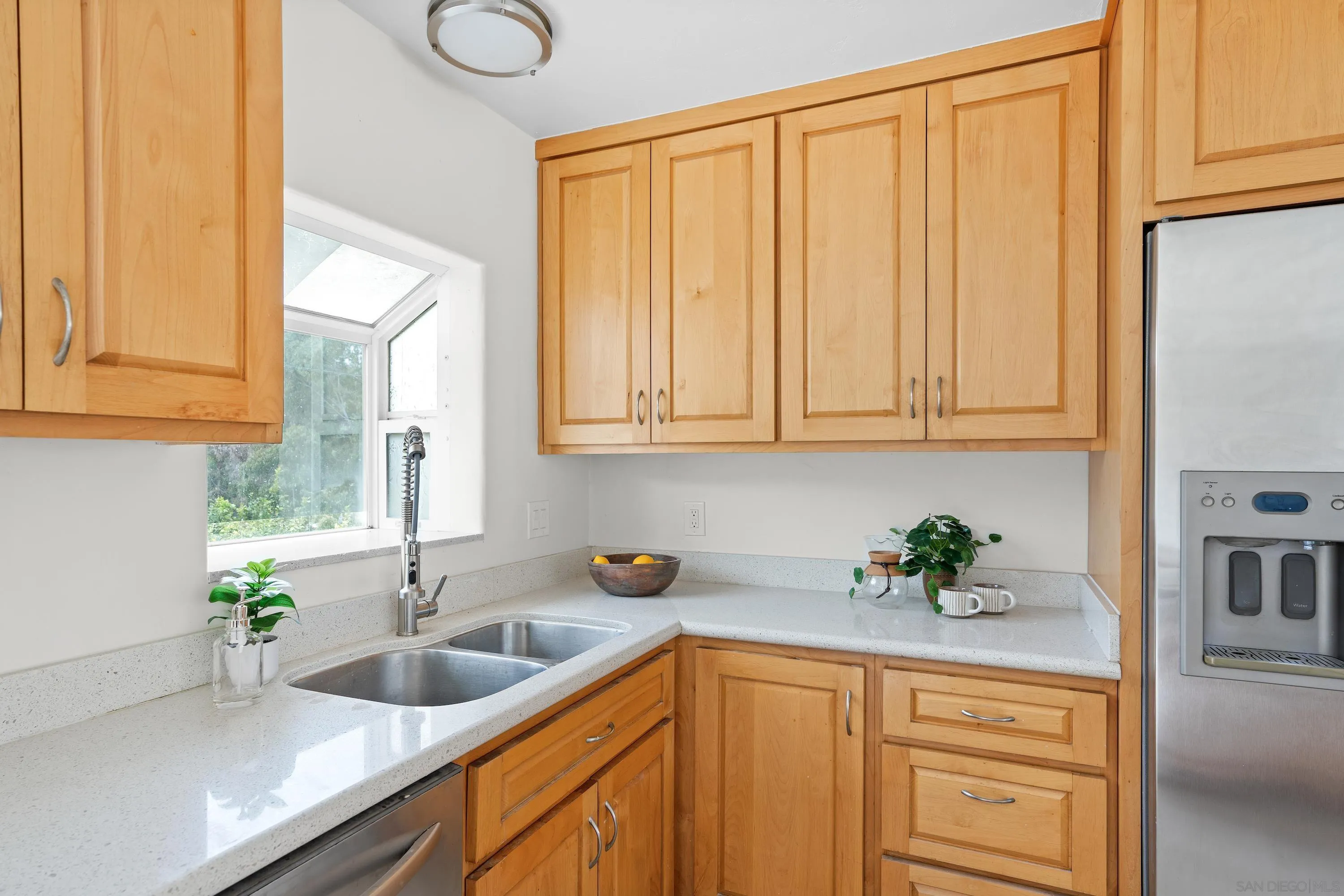 8612 Almond Road Lakeside, CA 92040 - Photo 22 of 30 a kitchen with stainless steel appliances granite countertop a sink a counter space and cabinets