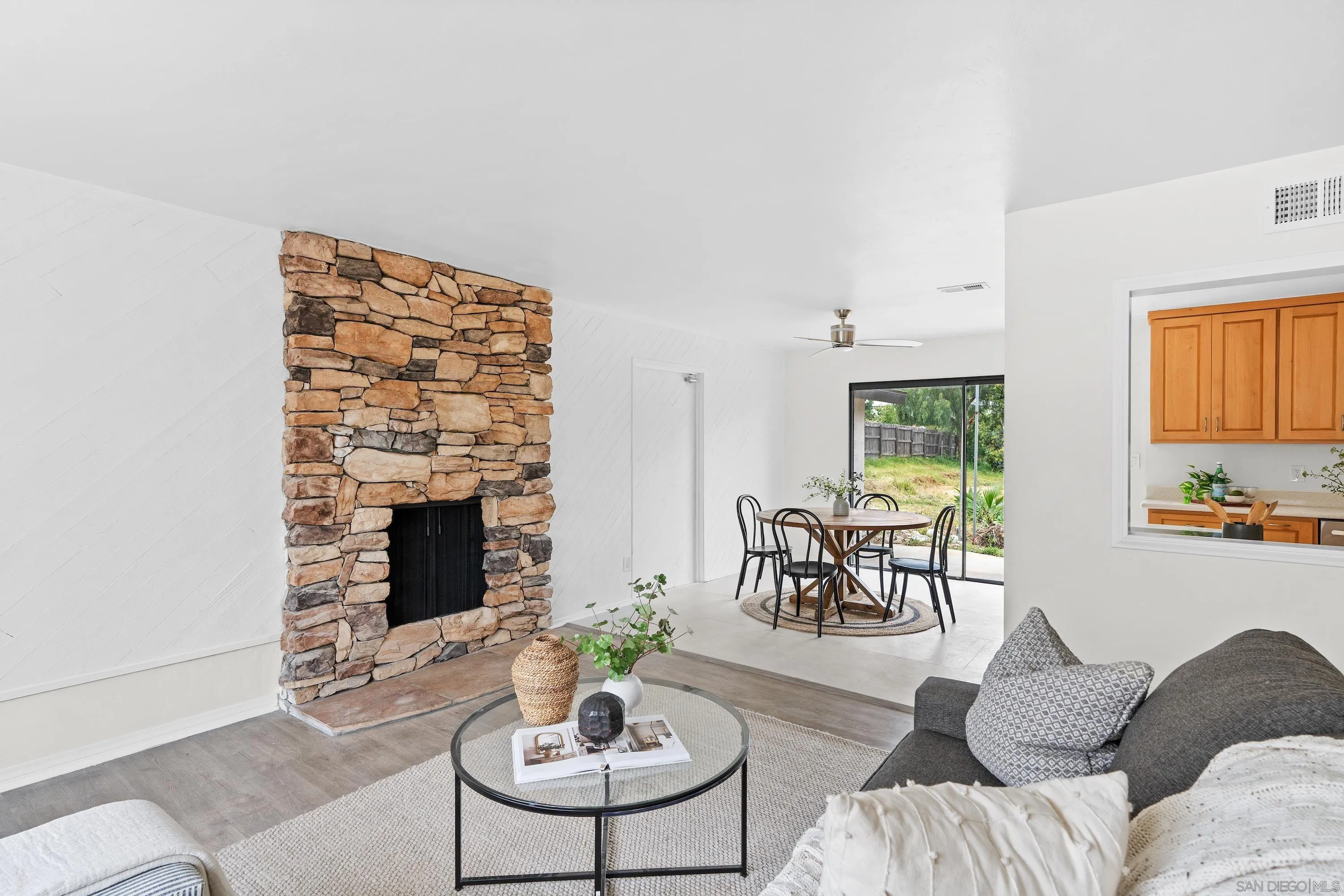 8612 Almond Road Lakeside, CA 92040 - Photo 6 of 30 a living room with furniture potted plant and a fireplace