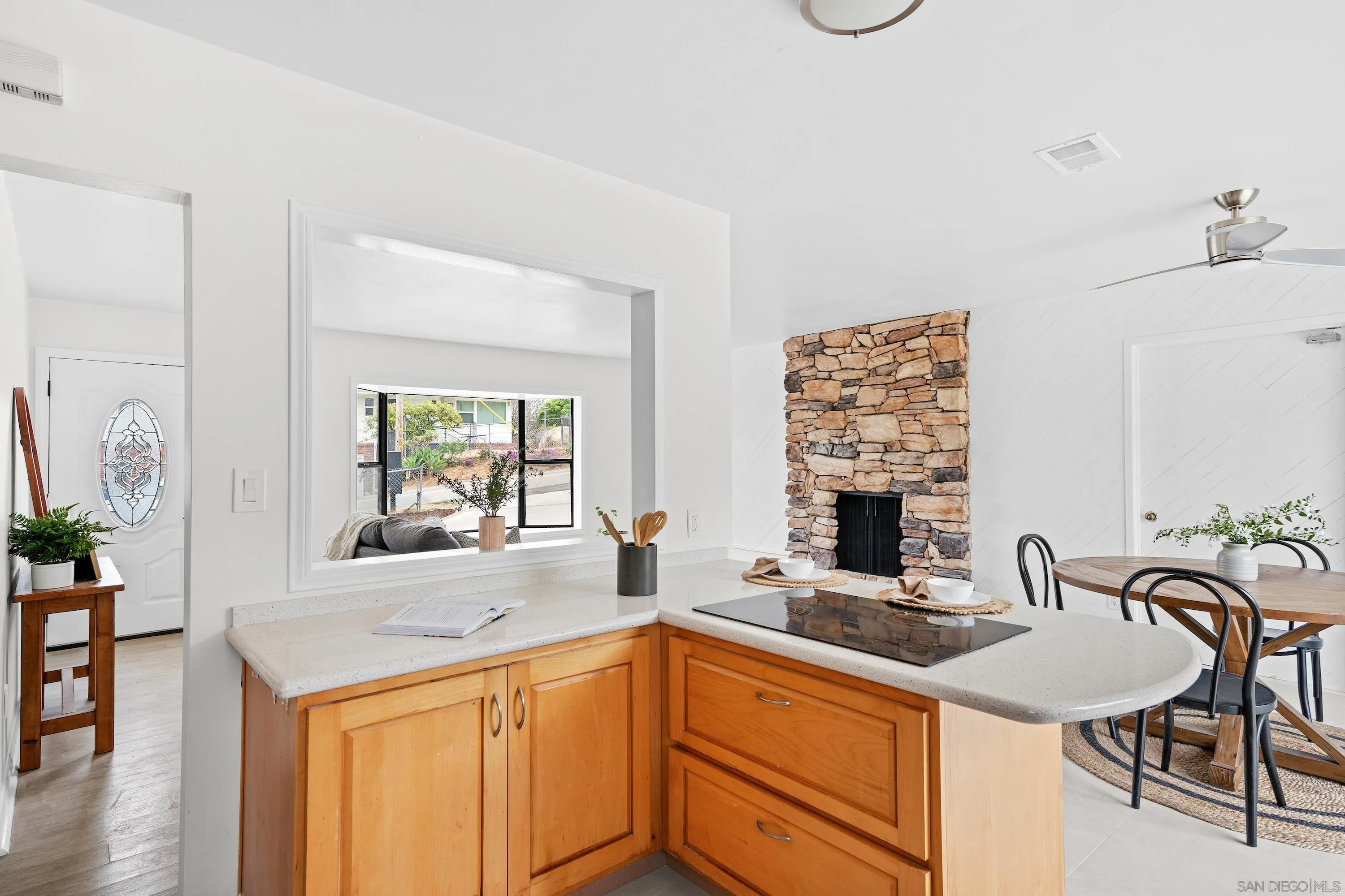 8612 Almond Road Lakeside, CA 92040 - Photo 9 of 30 a kitchen with stainless steel appliances a sink a counter space and a living room area