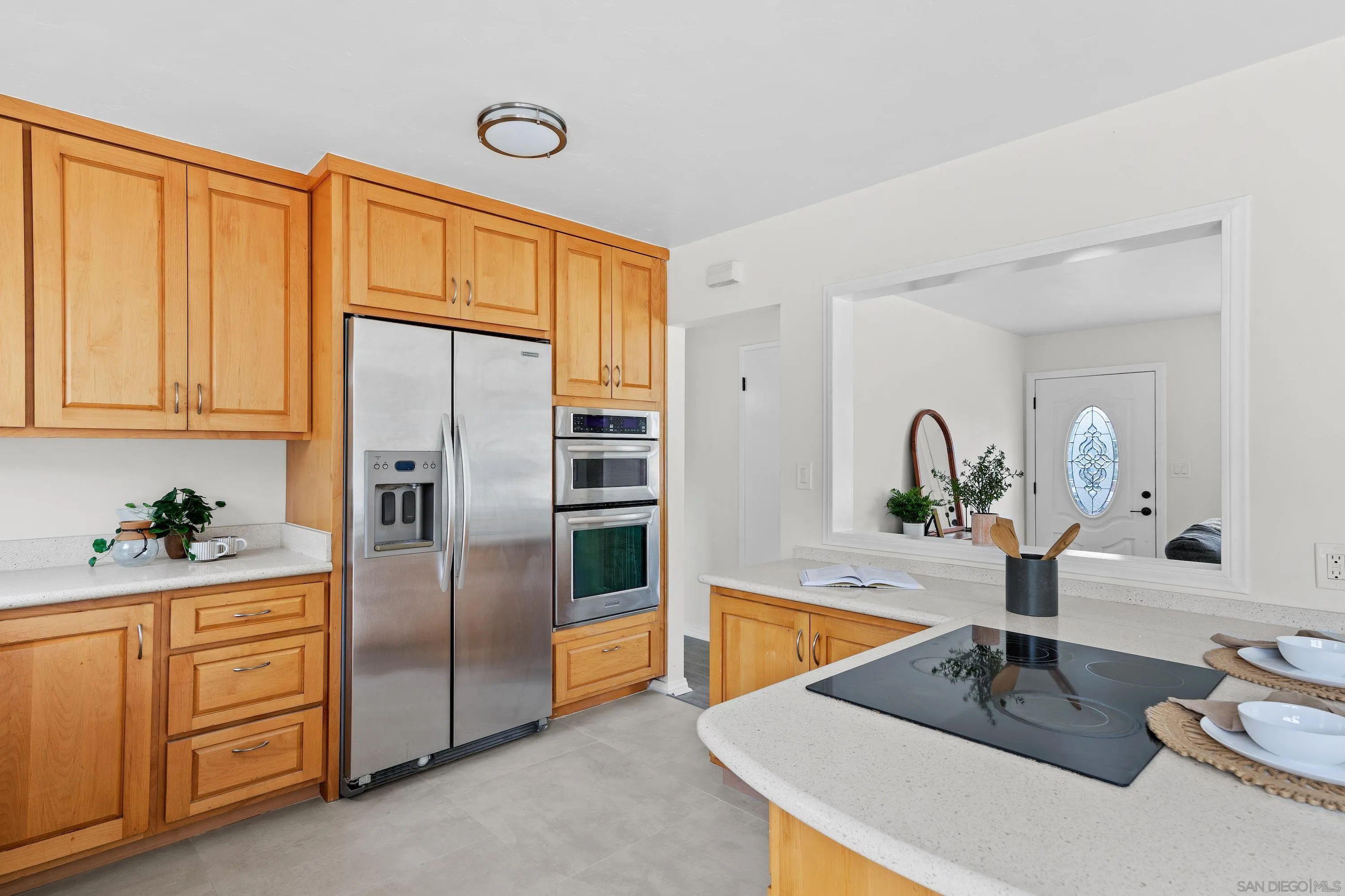 8612 Almond Road Lakeside, CA 92040 - Photo 10 of 30 a kitchen with stainless steel appliances a sink and a refrigerator