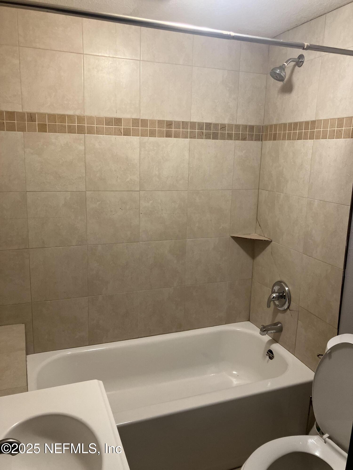 1663 West 35th Street Jacksonville, FL 32209 - Photo 15 of 16 a bathroom with a bathtub and a shower