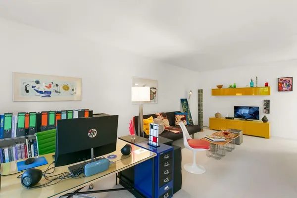 a living room with a fireplace and a table