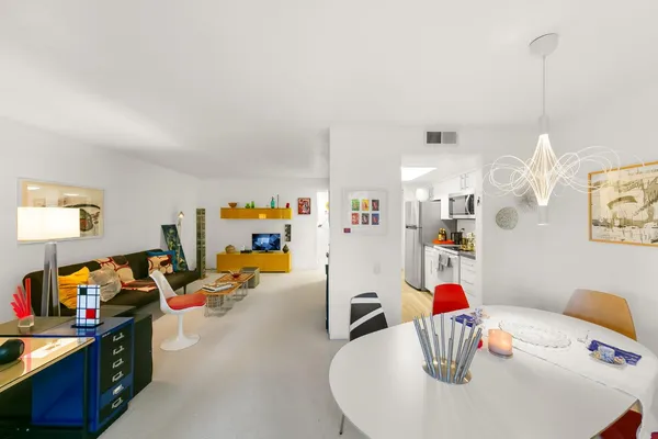 a bedroom with furniture and a fireplace