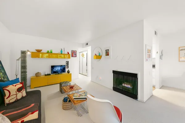 a kitchen with a sink a stove and cabinets