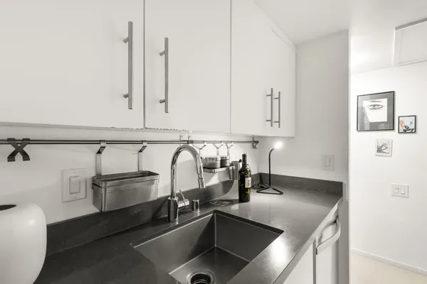 a bathroom with a sink double vanity and a toilet