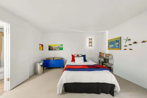 a view of a garden with large trees