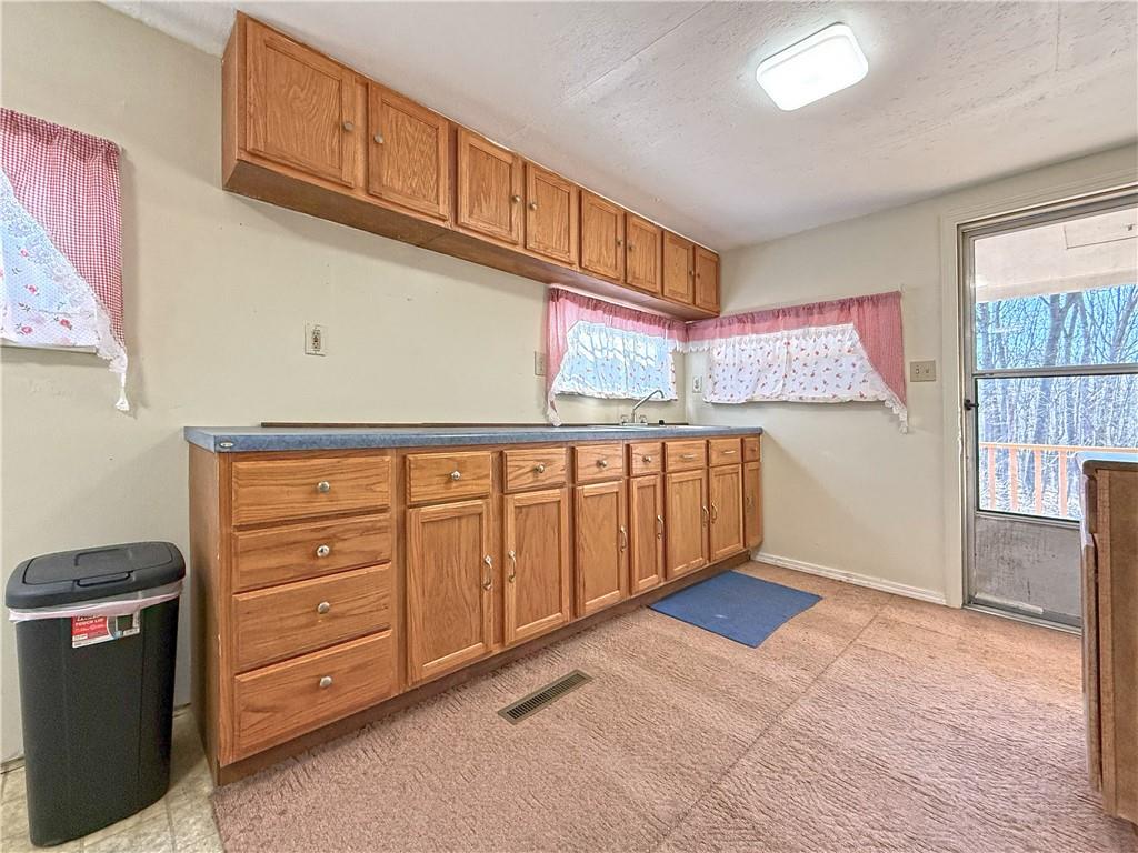 855 Highway 56 Apollo, PA 15613 - Photo 13 of 25 a kitchen with cabinets and wooden floor