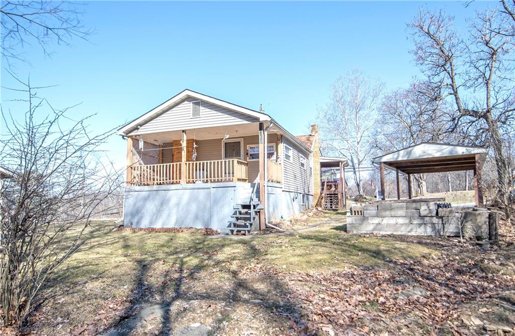 855 Highway 56 Apollo, PA 15613 - Photo 6 of 25 a front view of a house with a yard