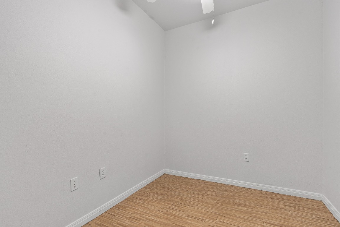 2515 Pearl Street, Unit 508 Austin, TX 78705 - Photo 12 of 25 Empty room with light wood finished floors and ceiling fan