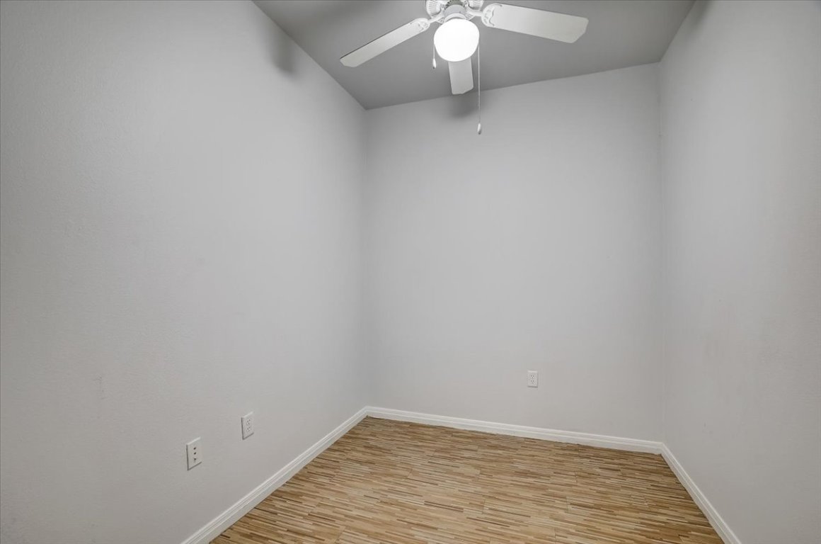 2515 Pearl Street, Unit 508 Austin, TX 78705 - Photo 5 of 25 Unfurnished room with light wood-style floors and ceiling fan