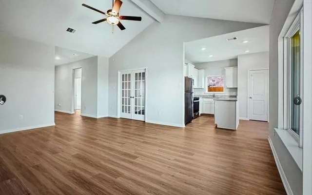 a view of a kitchen with a sink and a window